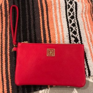 Clutch with built in portable charger